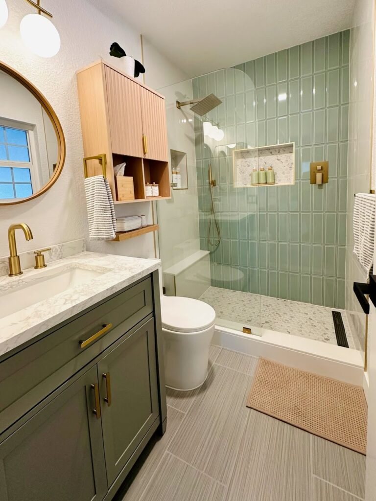 Modern bathroom with a sleek vanity, frameless glass shower, and stylish tilework – contemporary design with a clean and functional layout
